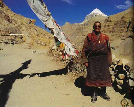 
Pilgrim at Tarboche with Kailash behind - The Rivers of the Mandala: Journey to the Heart of Buddhism book
